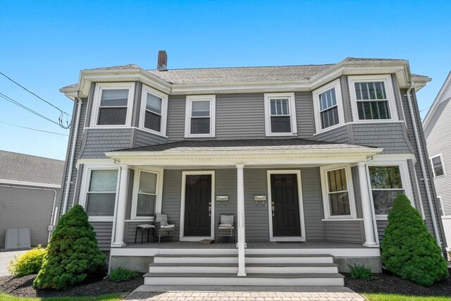 381 Hunnewell St Unit 381, Needham, MA 02494 - view of front of property featuring covered porch and a shingled roof
