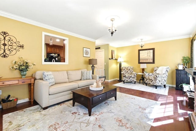 living area featuring baseboards, an inviting chandelier, wood finished floors, and ornamental molding