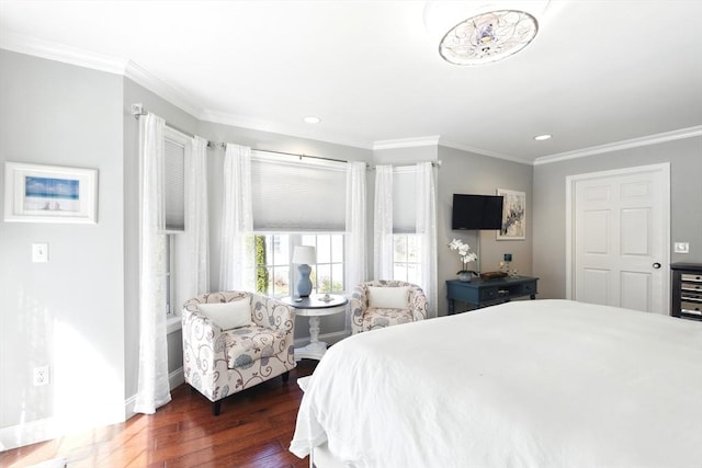 bedroom featuring recessed lighting, baseboards, wood finished floors, and crown molding