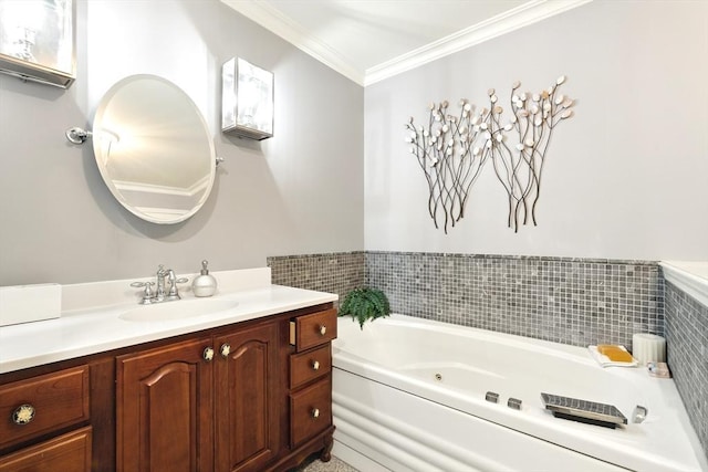 bathroom featuring a tub with jets, vanity, and crown molding