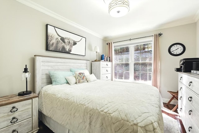 bedroom with crown molding and baseboards