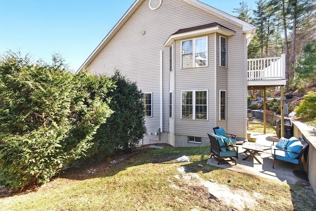 back of house with a patio, a yard, and an outdoor hangout area