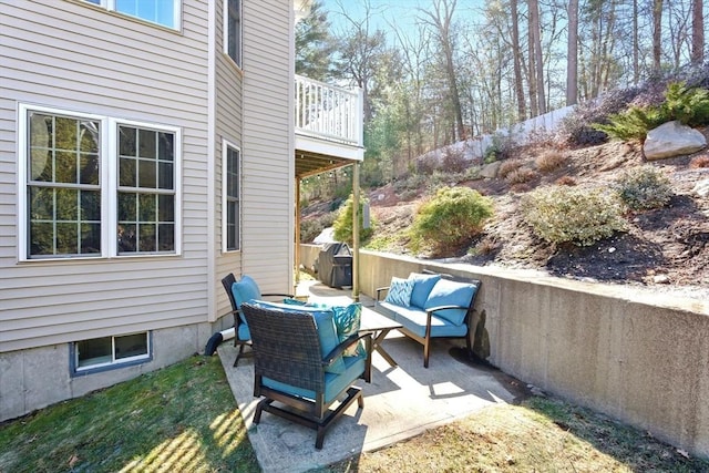 view of patio featuring an outdoor hangout area and a wooden deck