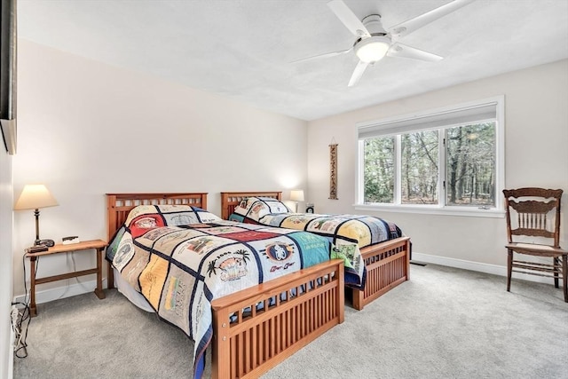 bedroom featuring a ceiling fan, baseboards, and carpet floors