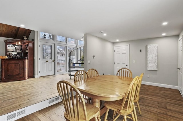 dining area featuring stairs, recessed lighting, wood finished floors, and baseboards