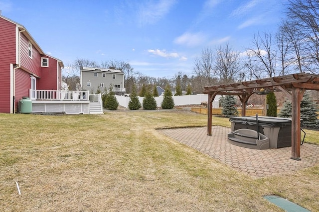 view of yard with a patio area, a wooden deck, a pergola, and fence