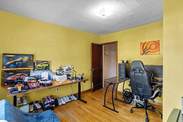 office area with hardwood / wood-style floors