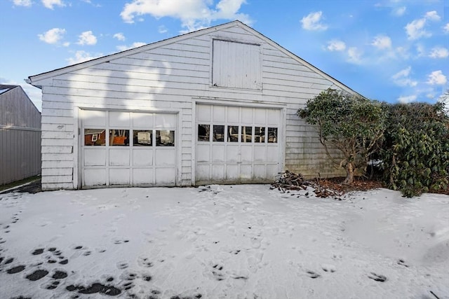 view of snow covered garage