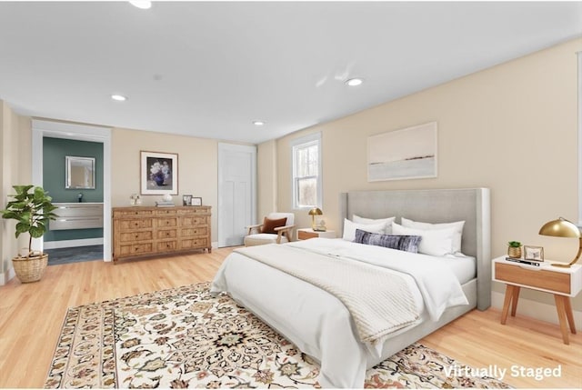 bedroom with hardwood / wood-style floors