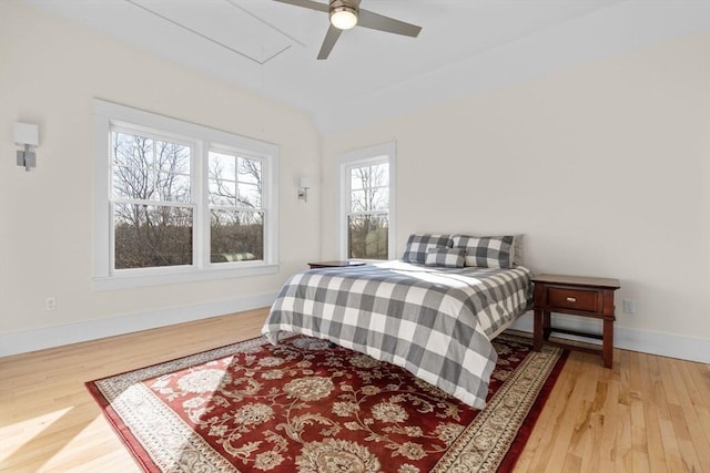 bedroom with ceiling fan and hardwood / wood-style flooring