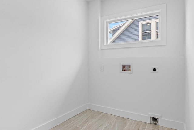 washroom with hookup for an electric dryer and hookup for a washing machine