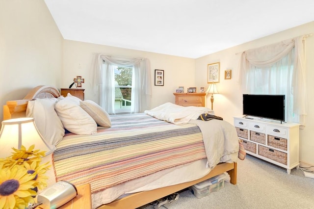 bedroom featuring light carpet