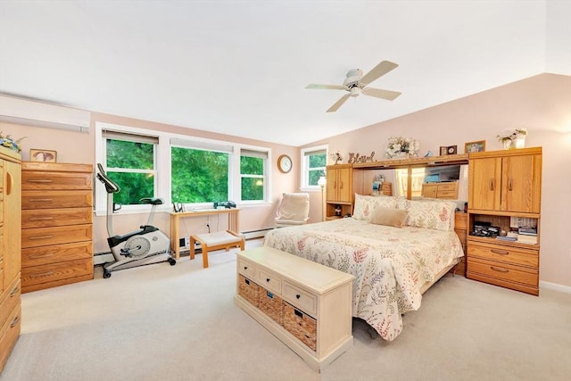 bedroom with vaulted ceiling, light carpet, baseboard heating, and ceiling fan