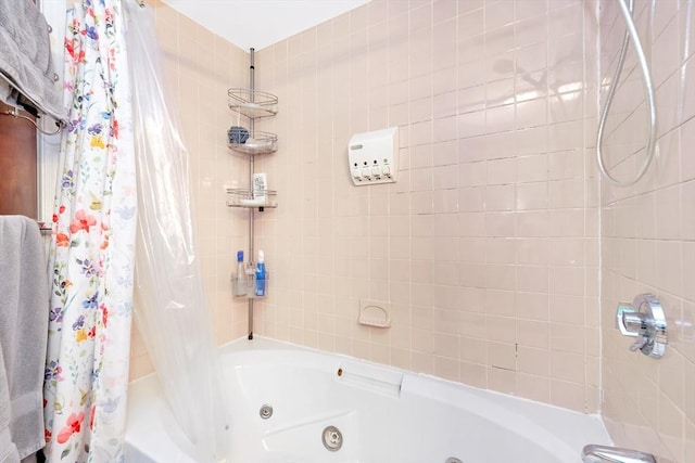 full bathroom with a combined bath / shower with jetted tub