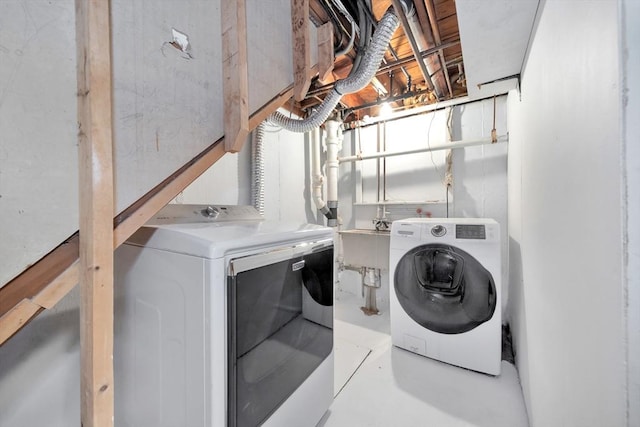 laundry room featuring washer and clothes dryer