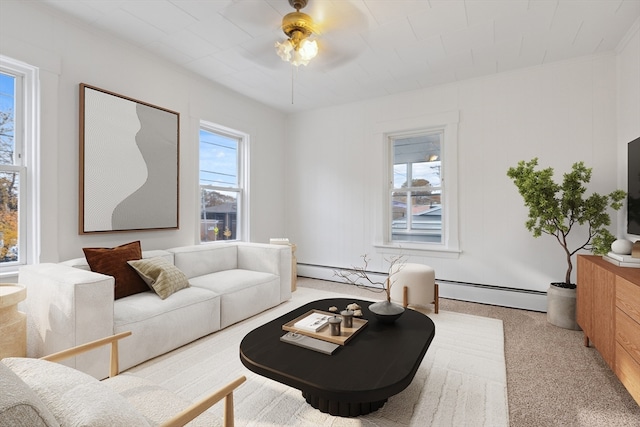 living room featuring ceiling fan, a baseboard radiator, and light colored carpet