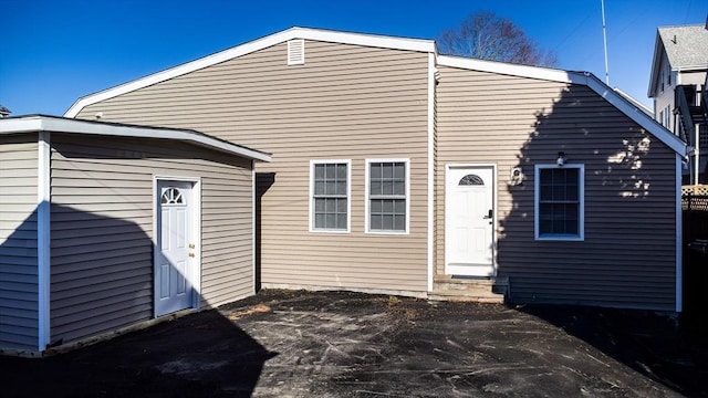 rear view of property featuring a patio area