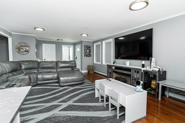 living room featuring a fireplace, crown molding, dark wood-type flooring, and baseboard heating