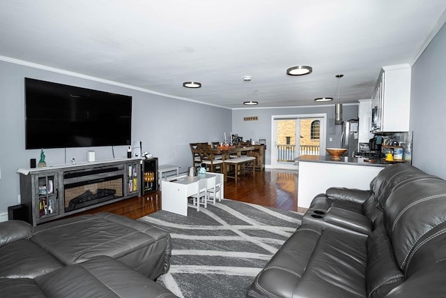 living room featuring ornamental molding and dark hardwood / wood-style floors