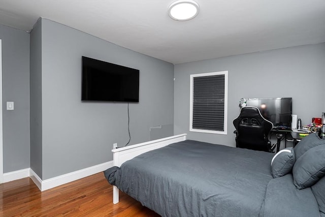 bedroom with wood-type flooring