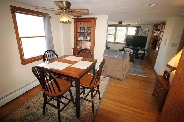 786 Cabot St, Beverly, MA 01915 - dining space featuring ceiling fan, light wood-type flooring, a baseboard radiator, and recessed lighting