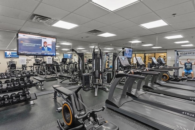 workout area featuring a paneled ceiling