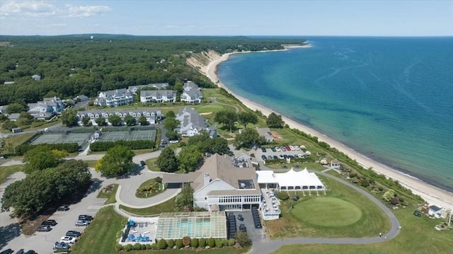 drone / aerial view with a water view and a view of the beach