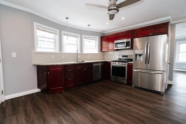 27 Morgan St, Fairhaven, MA 02719 - kitchen with stainless steel appliances, dark brown cabinets, backsplash, ceiling fan, and ornamental molding