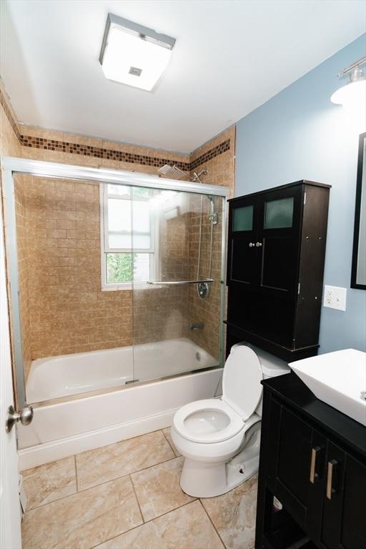 27 Morgan St, Fairhaven, MA 02719 - bathroom featuring combined bath / shower with glass door, vanity, and tile patterned floors