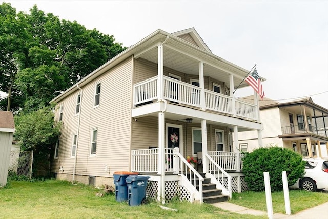 27 Morgan St, Fairhaven, MA 02719 - view of front of home featuring a balcony, covered porch, and a front yard