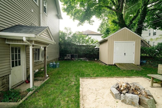 27 Morgan St, Fairhaven, MA 02719 - view of grassy yard with a fire pit and a shed