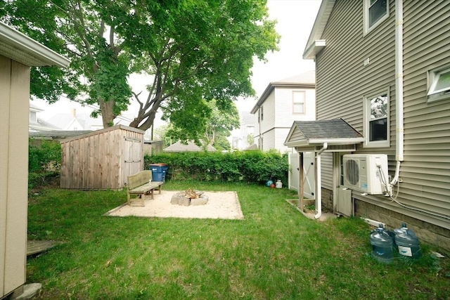 27 Morgan St, Fairhaven, MA 02719 - view of grassy yard featuring a shed, a patio, and an outdoor fire pit