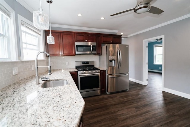 27 Morgan St, Fairhaven, MA 02719 - kitchen with appliances with stainless steel finishes, a ceiling fan, crown molding, backsplash, and dark wood finished floors
