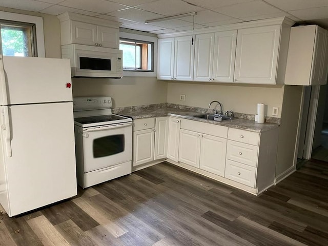 160 7th St, Leominster, MA 01453 - kitchen with white appliances, a paneled ceiling, white cabinets, and dark wood-style flooring