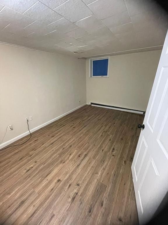 160 7th St, Leominster, MA 01453 - empty room with baseboard heating and wood finished floors