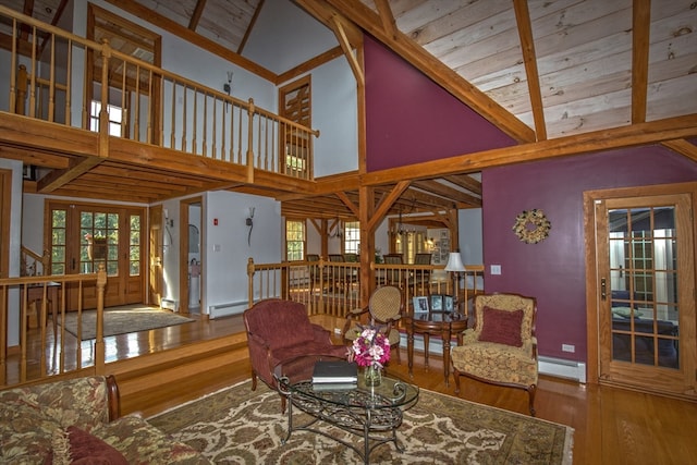 living room with wooden ceiling, hardwood / wood-style floors, a baseboard heating unit, and high vaulted ceiling