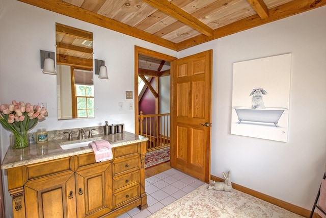 bathroom featuring wood ceiling, tile patterned flooring, vanity, and beamed ceiling