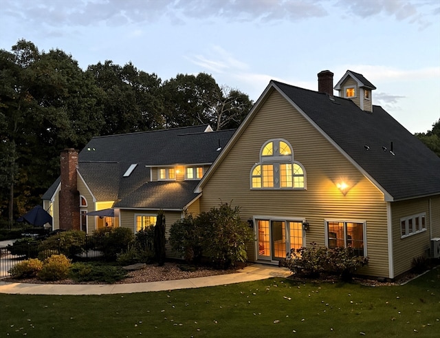 back of house featuring a yard