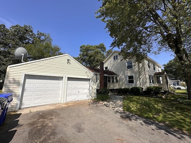 250 Gresham St, Springfield, MA 01119 - view of property exterior featuring asphalt driveway and a garage