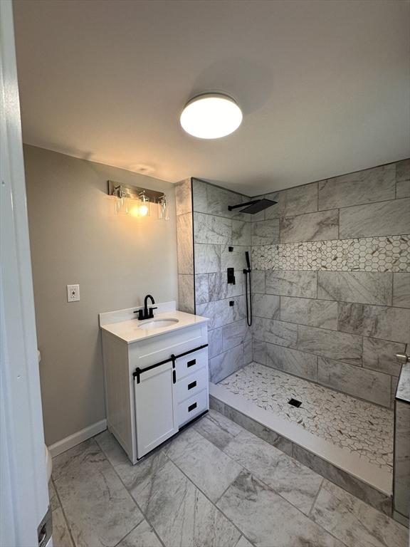 250 Gresham St, Springfield, MA 01119 - full bath with vanity, a tile shower, and marble finish floors