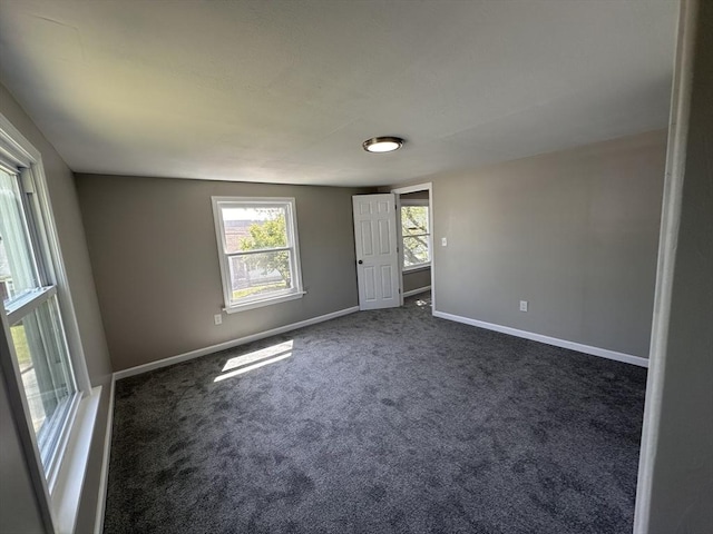 250 Gresham St, Springfield, MA 01119 - empty room with baseboards and dark carpet