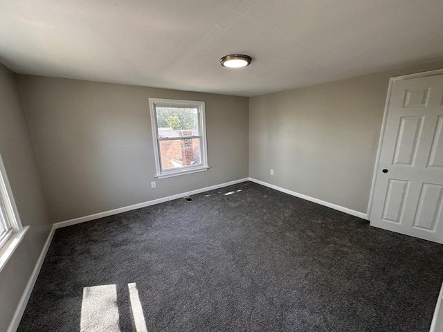 250 Gresham St, Springfield, MA 01119 - empty room featuring baseboards and dark carpet