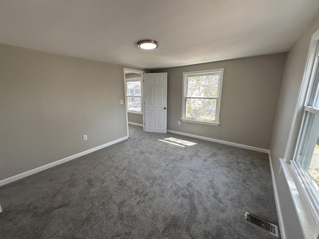 250 Gresham St, Springfield, MA 01119 - unfurnished bedroom with dark colored carpet and baseboards
