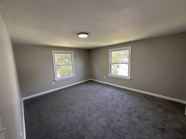 250 Gresham St, Springfield, MA 01119 - empty room featuring baseboards and dark colored carpet