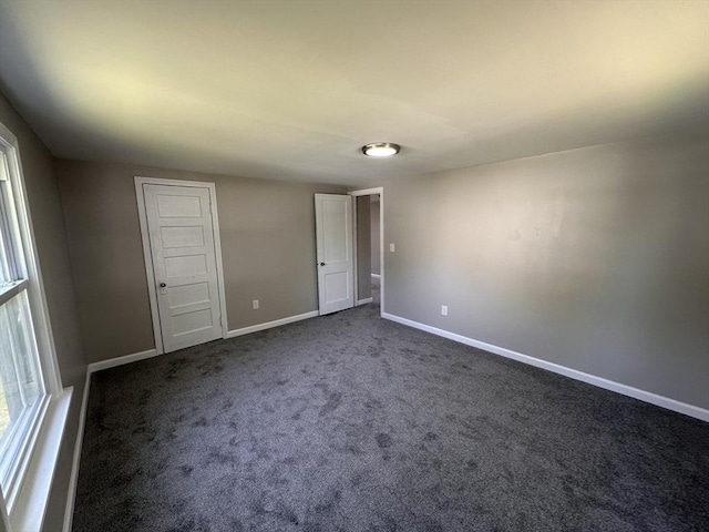 250 Gresham St, Springfield, MA 01119 - unfurnished bedroom featuring dark colored carpet and baseboards