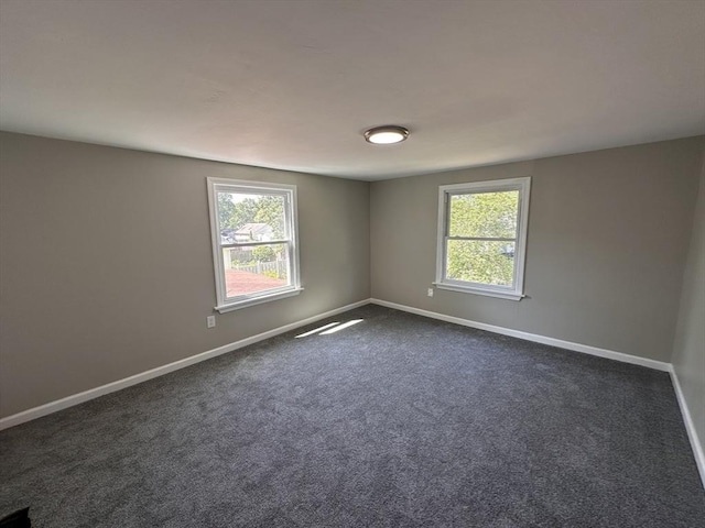 250 Gresham St, Springfield, MA 01119 - unfurnished room featuring baseboards and dark carpet
