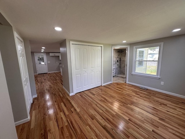 250 Gresham St, Springfield, MA 01119 - unfurnished bedroom with wood finished floors, recessed lighting, a closet, and connected bathroom