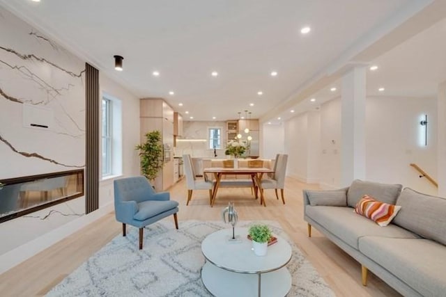 living room with recessed lighting and light wood finished floors