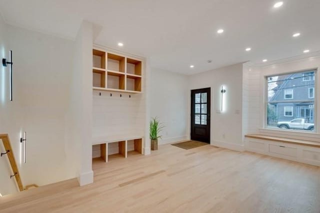 mudroom with light wood finished floors, baseboards, and recessed lighting