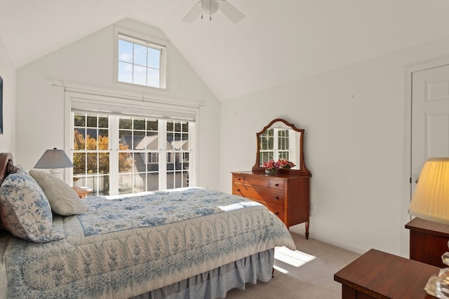 bedroom with ceiling fan, carpet floors, and lofted ceiling